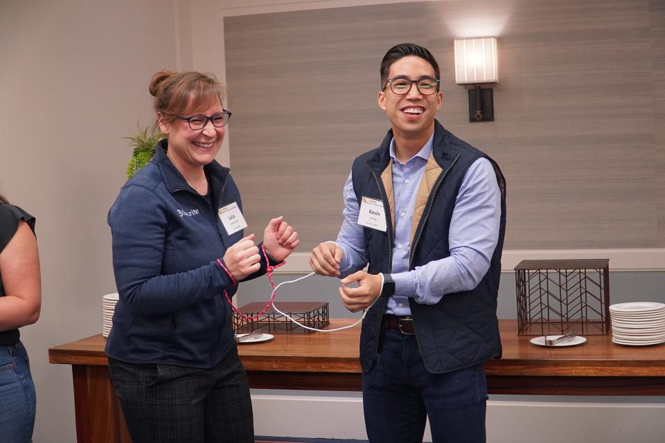 UC Davis MBA students Julia Greenspan (left) and Kevin Leung (right) participate in a team-building activity that proved collaboration was a shared concept amongst leaders.