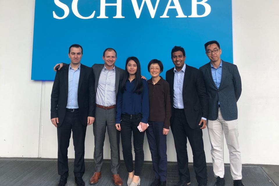 MBA students pose with Schwab executives