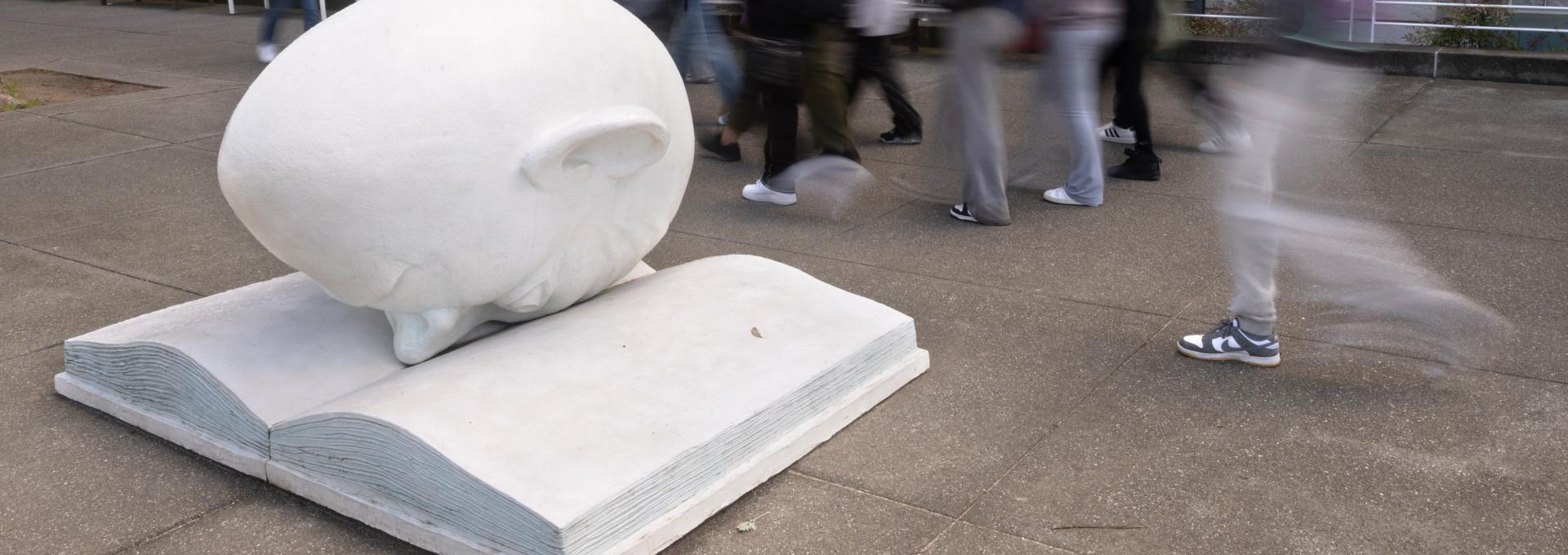 Egghead statue in front of Shields Library