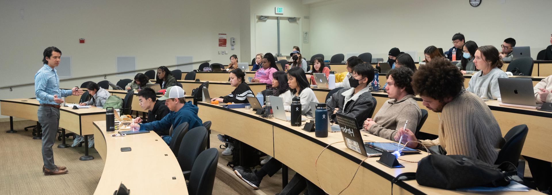 Students in a classroom, Paul Wong teaching