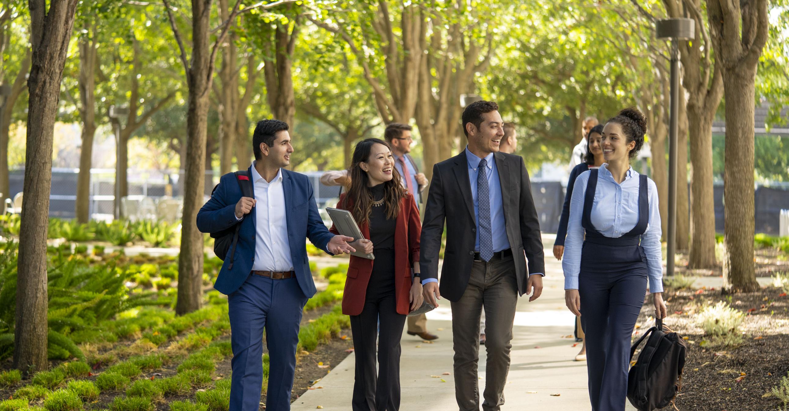 Group of people walking down a path