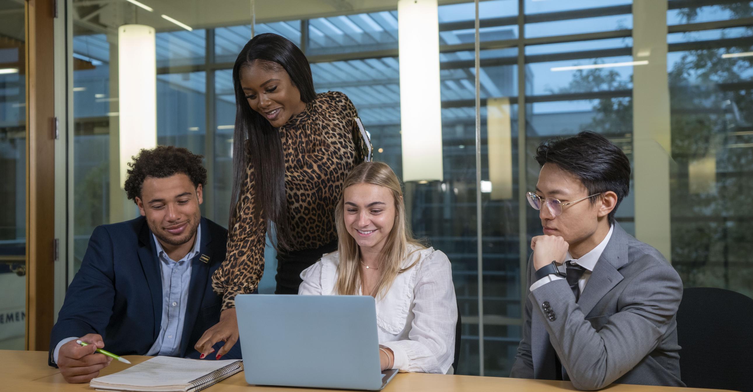 Individuals lookin at a computer