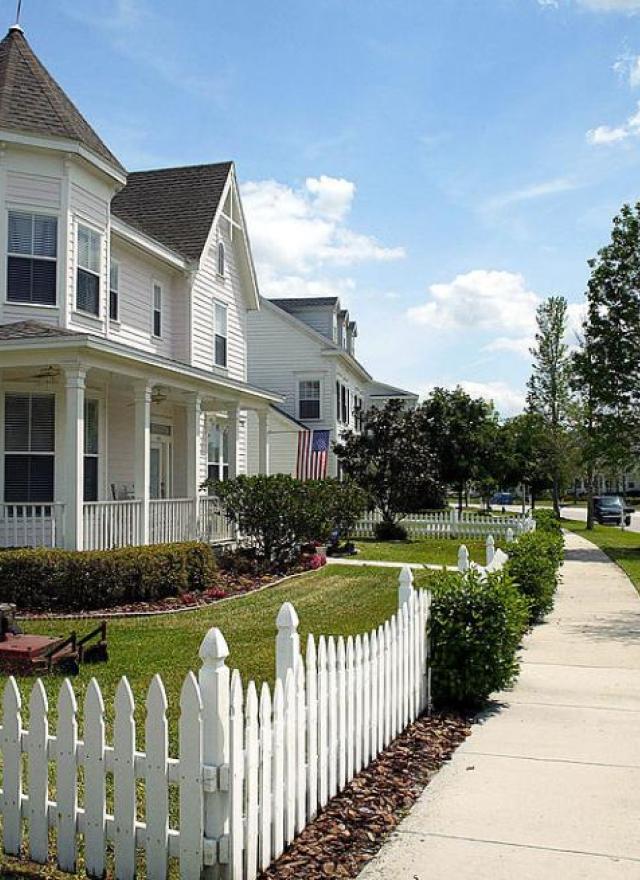 Suburban house with white picket fence