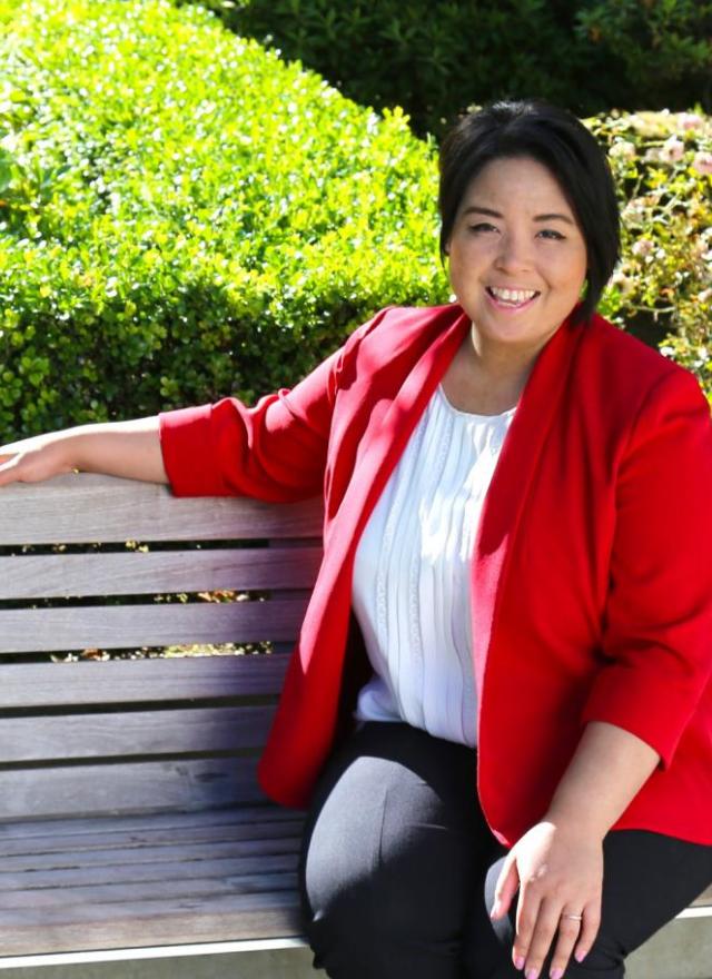 Janette Cruz sitting on a park bench