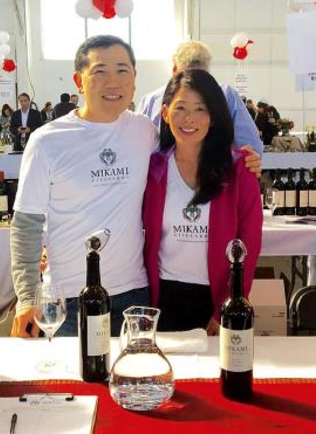 Jason Mikami at a wine expo with a family member