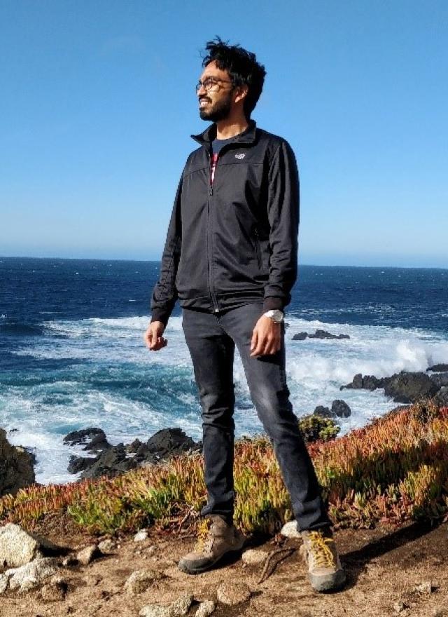 Tarun Chinniah MBA 21 stares out at the ocean