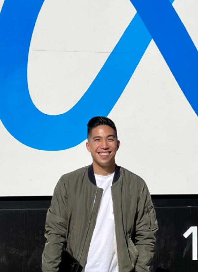 Part-time MBA student Kevin Leung MBA 23 stands outside his employer Meta.