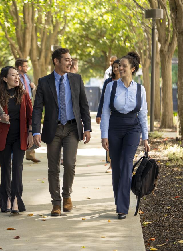 Group of people walking down a path