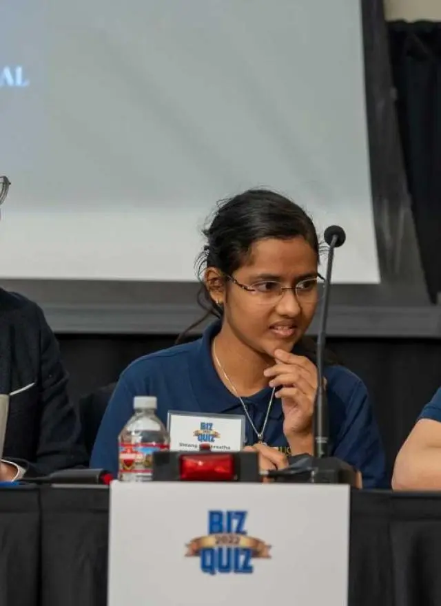 Biz Quiz competitors sitting at a table