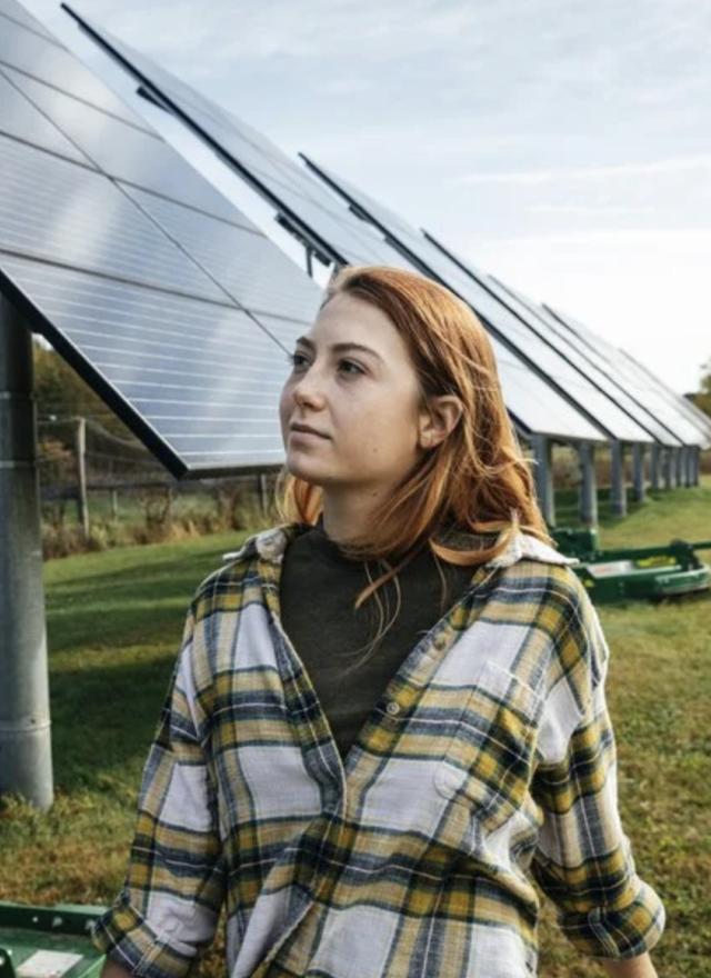 woman-in-front-of-solar-panels.width-880