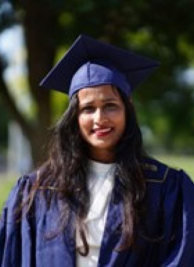 Arpita Mangal wearing a graduation cap and gown