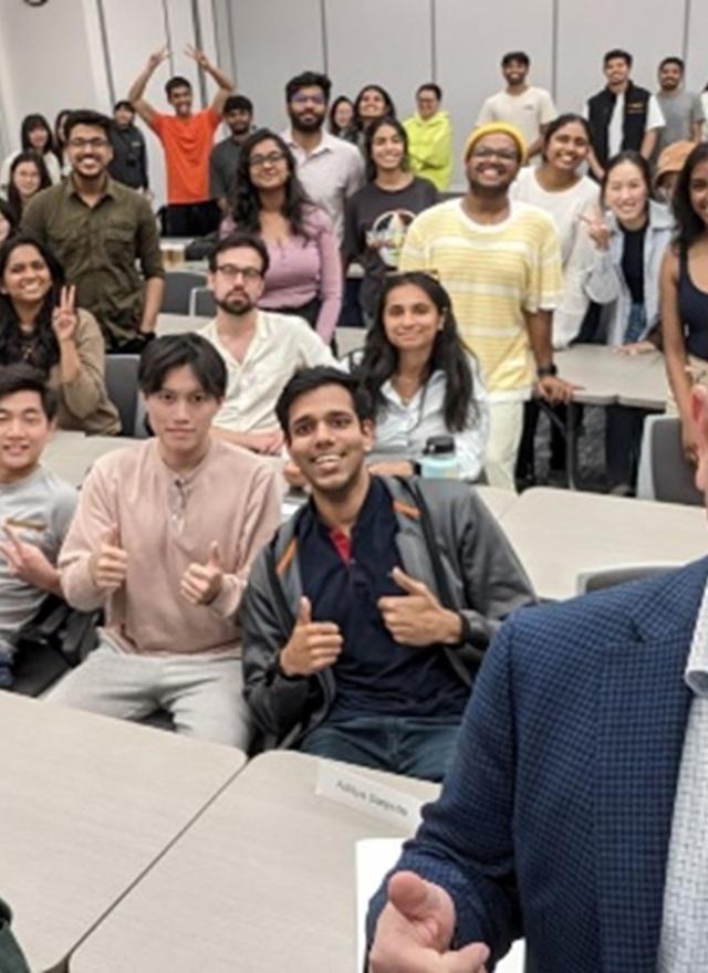 MakAhmad and Marco Casalaina take a selfie with MSBA students