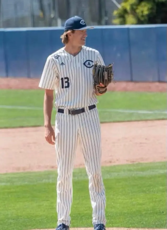 Carter Delaney wearing a baseball uniform and standing on the pitcher's mound