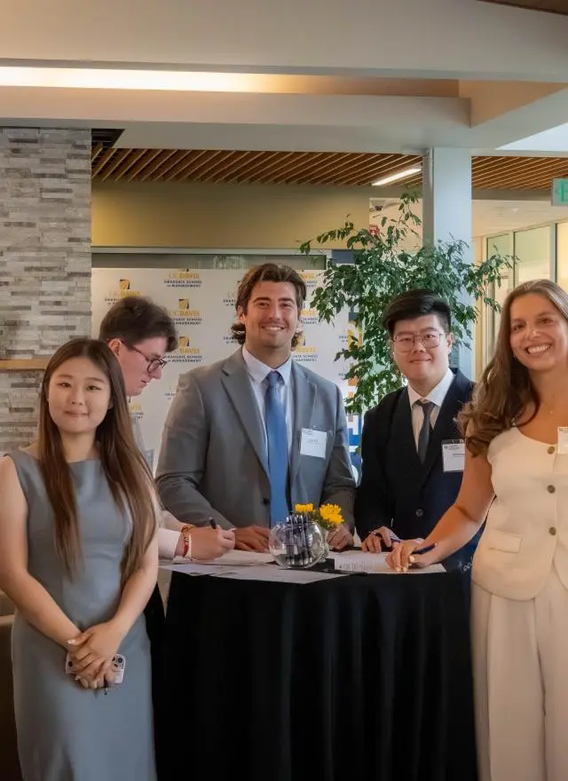 a group of Master of Management students in Gallagher Hall