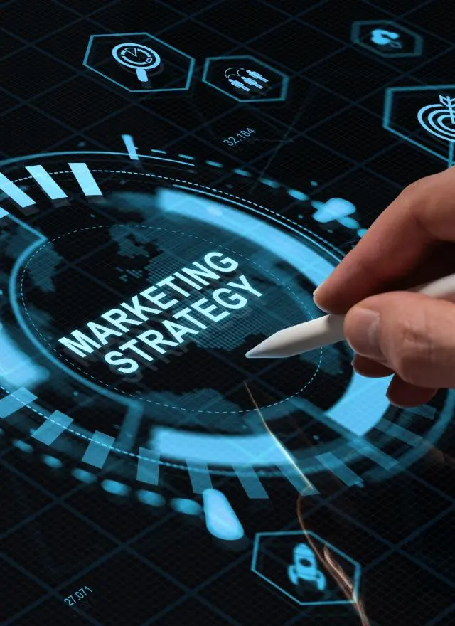 Graphic showing hand writing with pen on computer marketing strategy