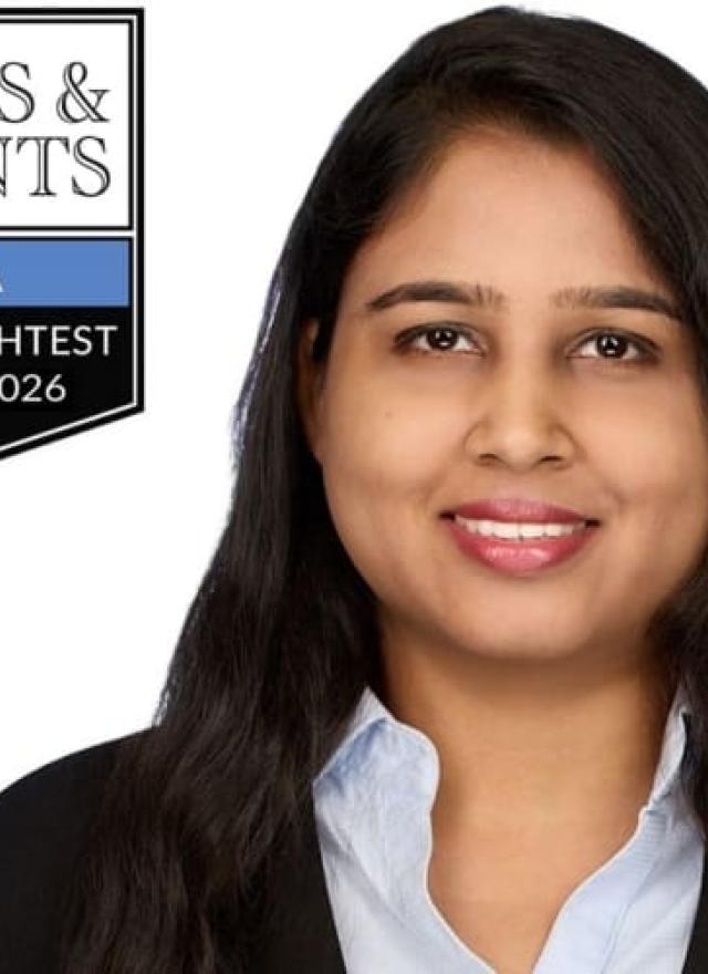 UC Davis MBA Shuphi Gupta in business attire smiles at the camera next to a "Poets & Quants MBA Best & Brightest Class of 2026" badge on a white background.