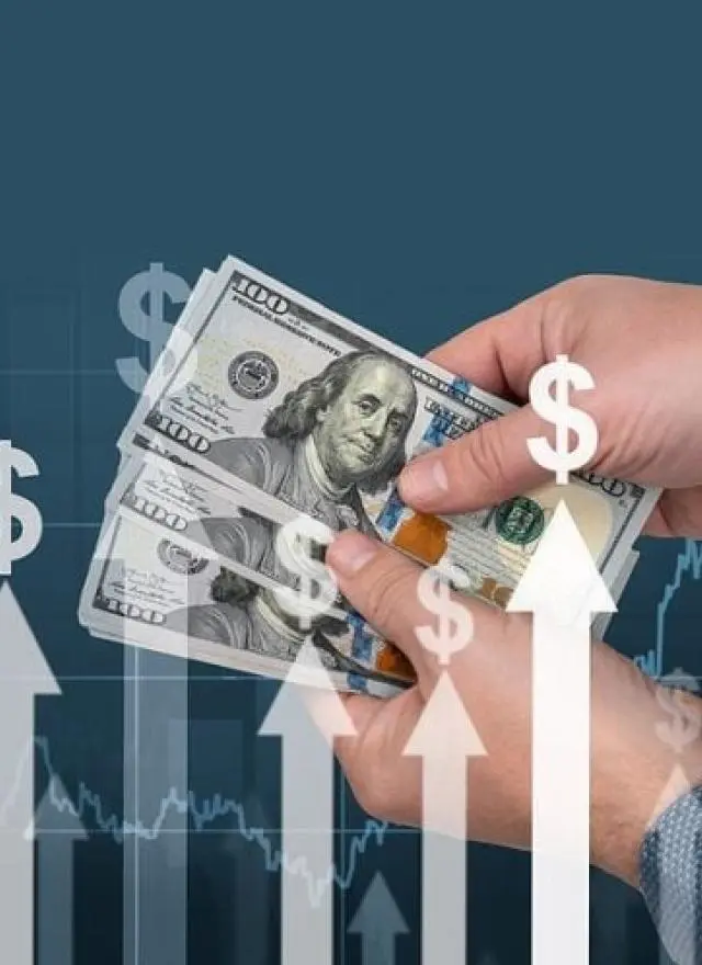 A person holds several US $100 bills, with upward-pointing white arrows and dollar signs symbolizing financial growth or rising profits.