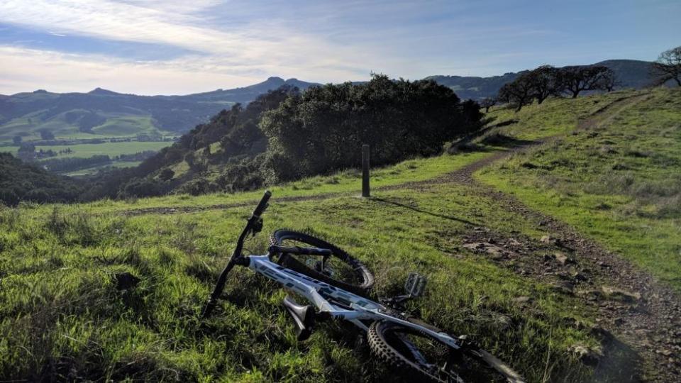 Mountain bike on top of grassy hill