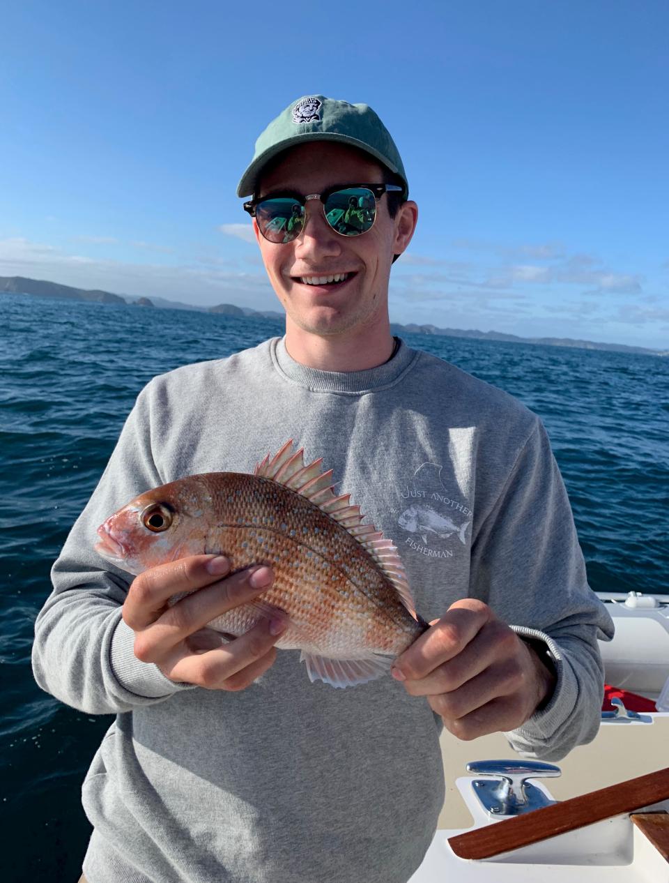 Oscar Halliwell fishing in the Bay of Island, New Zealand. 