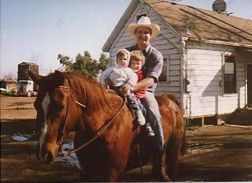Brie Hunt and her older brother on a horse with their dad in Lodi. 