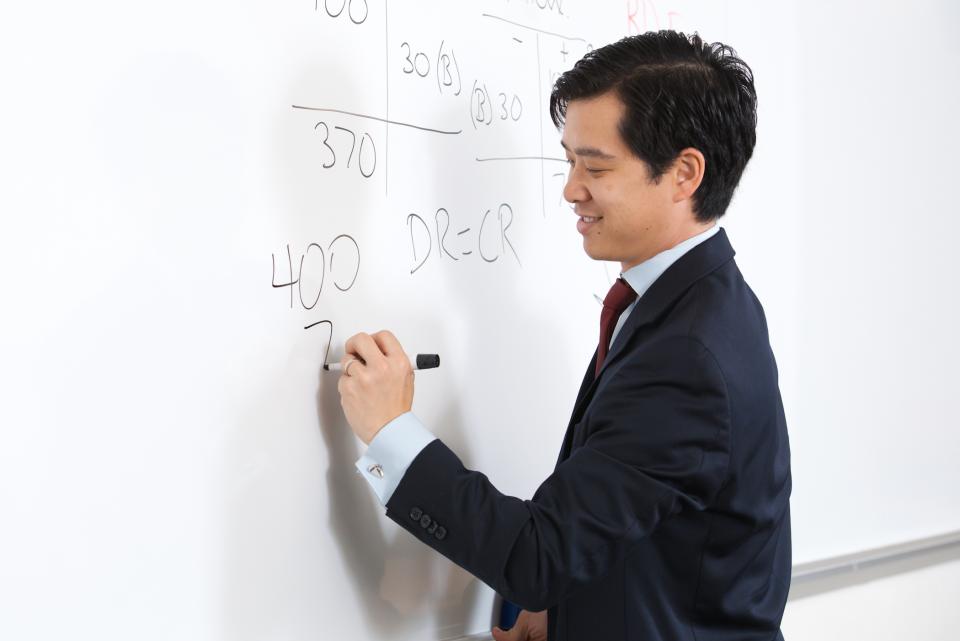 Accounting Professor Paul Wong at the white board