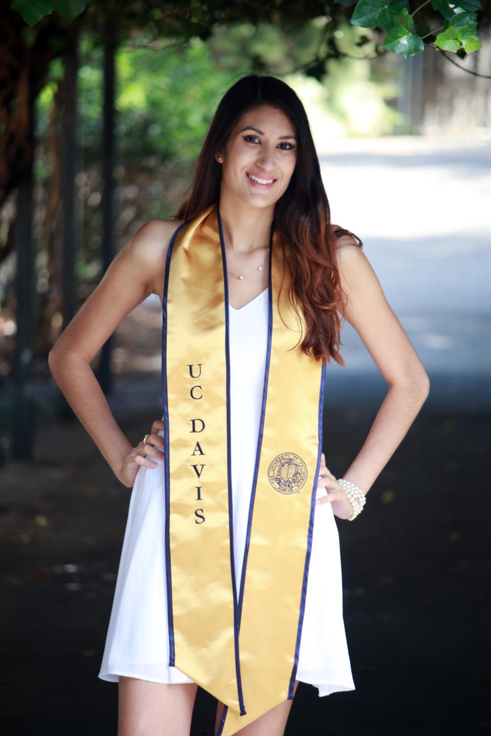 Leticia Garay displays her commencement stole from UC Davis 