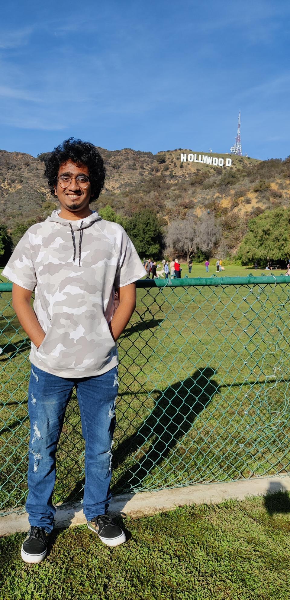 Keshore Suryanarayanan in front of the Hollywood sign
