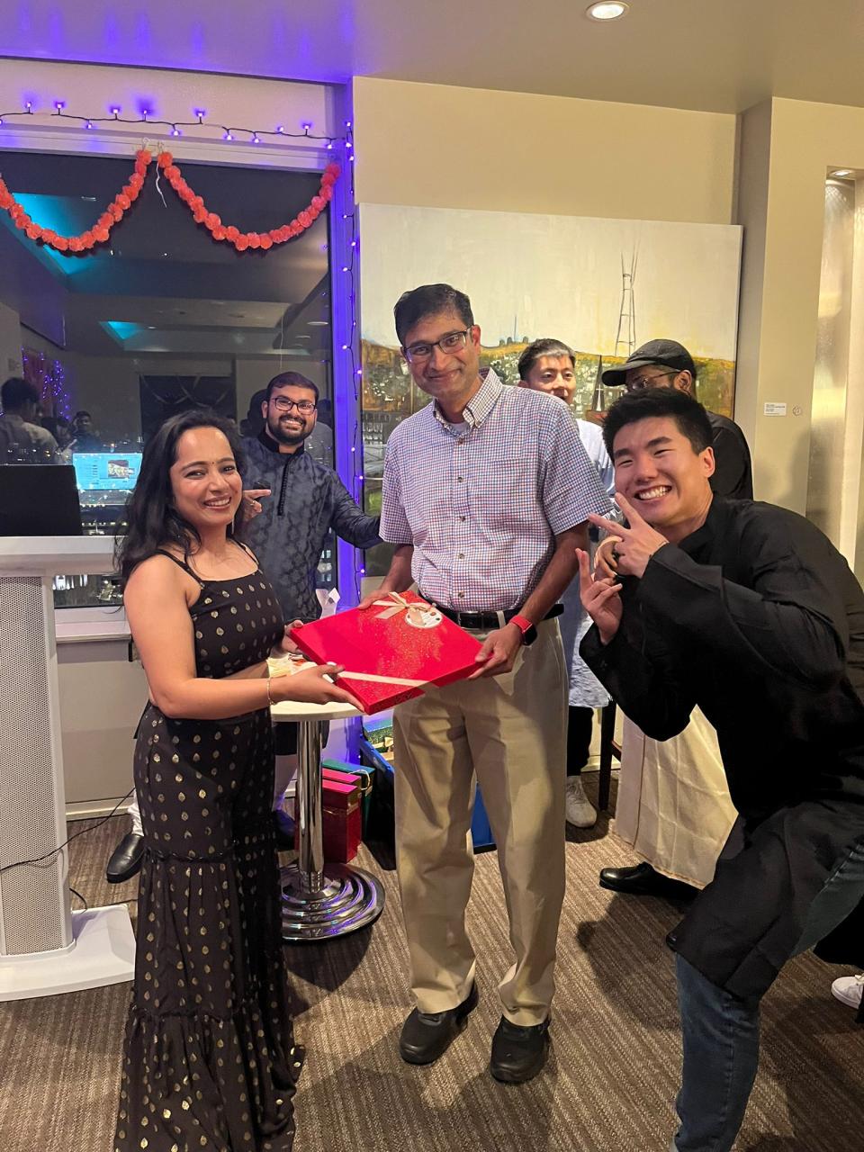 At the MSBA program’s Diwali celebration in San Francisco, Mehul Rangwala receives a gift from his enthusiastic students. 