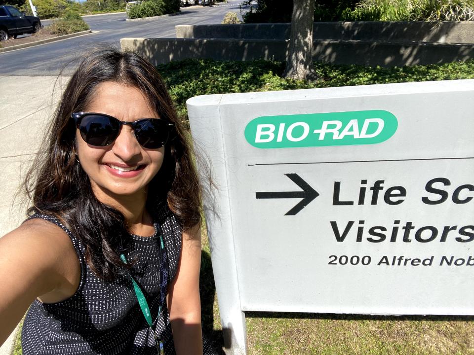 Woman standing in front of bio-rad company sign