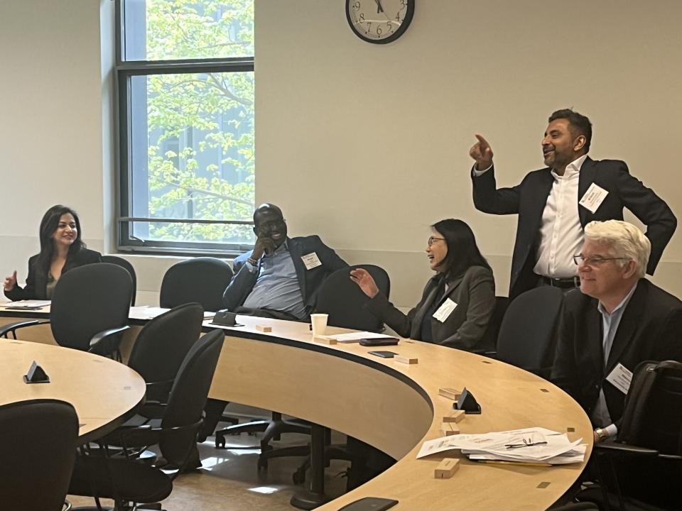 Judges (from left to right) Sukhpreet Sandhu and Vincent Asiago of HM.CLAUSE, Yu Shi from the Coca Cola Co., Brijesh Krishnaswamy from Olam Spices and Marcus Meadows-Smith from BioConsortia, review the presentations as they deliberate over their decisions. 