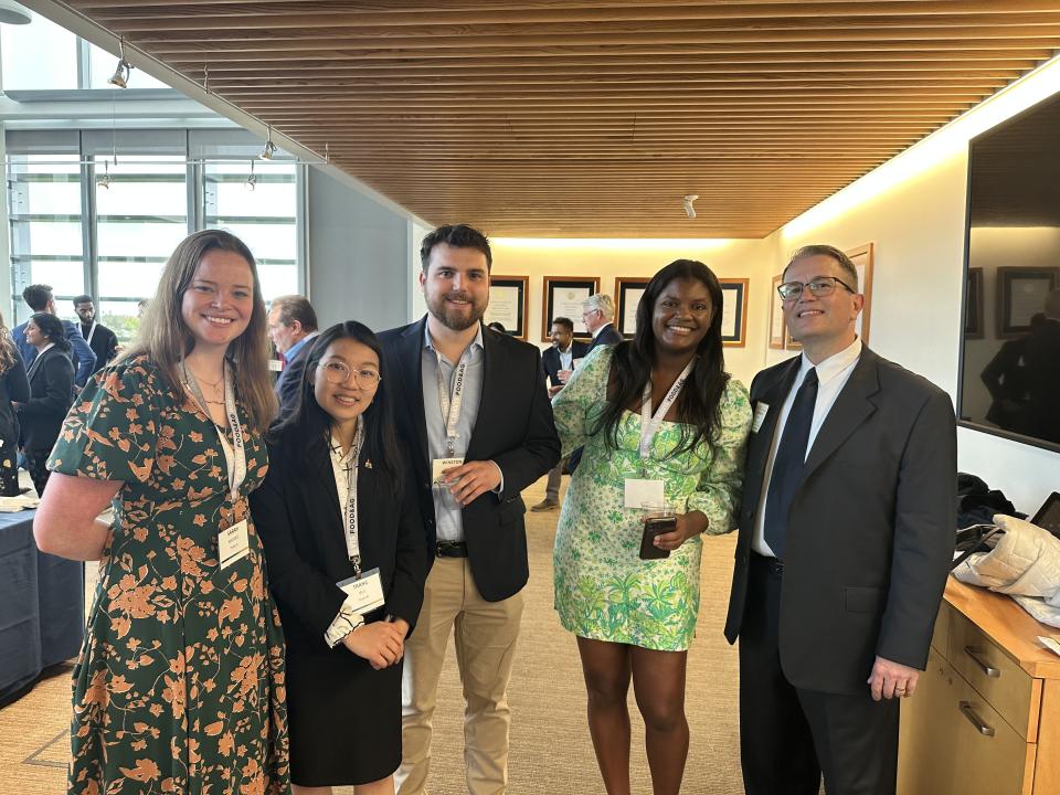 Students from Colorado State University and University of California, Riverside, meet during the opening reception with UC Davis MBA alumnus Matthew Weeks of E. & J. Gallo Winery, a judge in the competition.