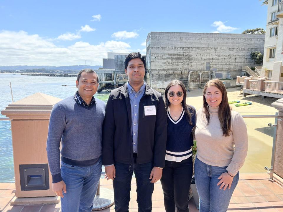 Abhinav Kishore with UC Davis students on a pier in Monterey 