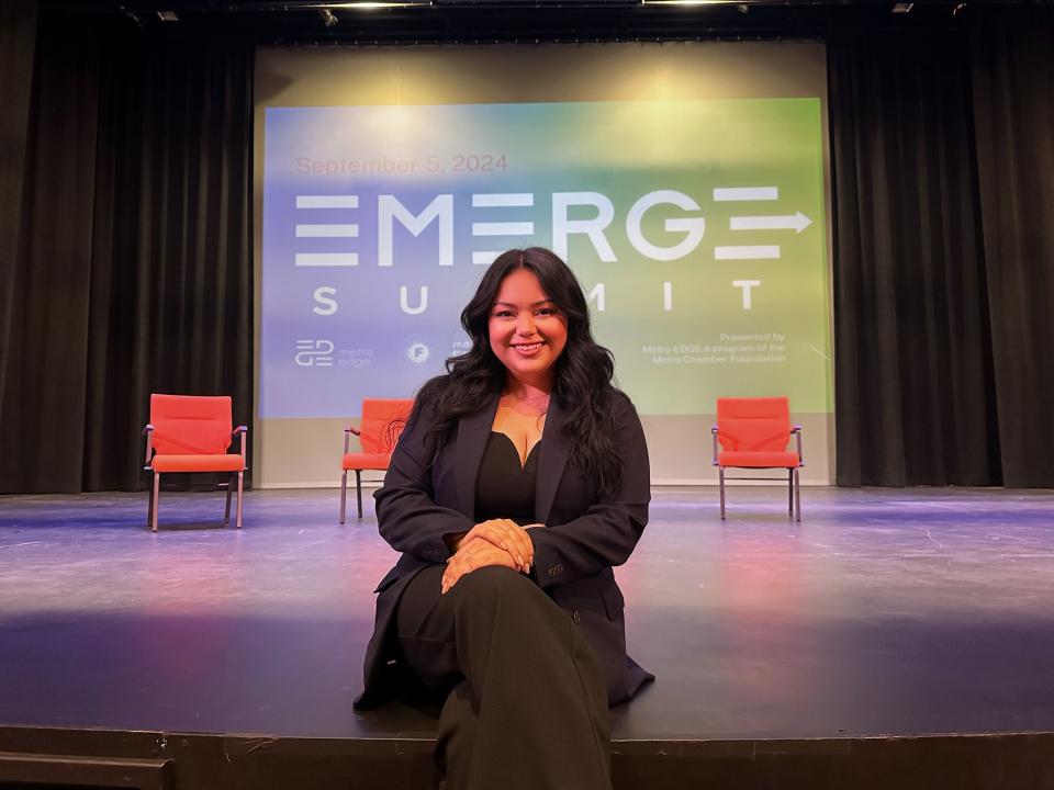 Marissa Hernandez sitting on a stage