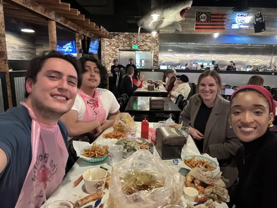 MPAc students seated at a table at Boiling Crab