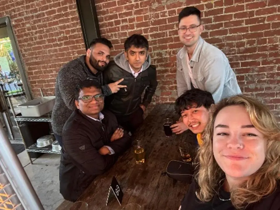 Anirudh Arora and MBA students at brewery 