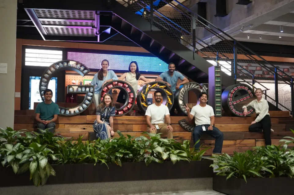 people in front of Google sign