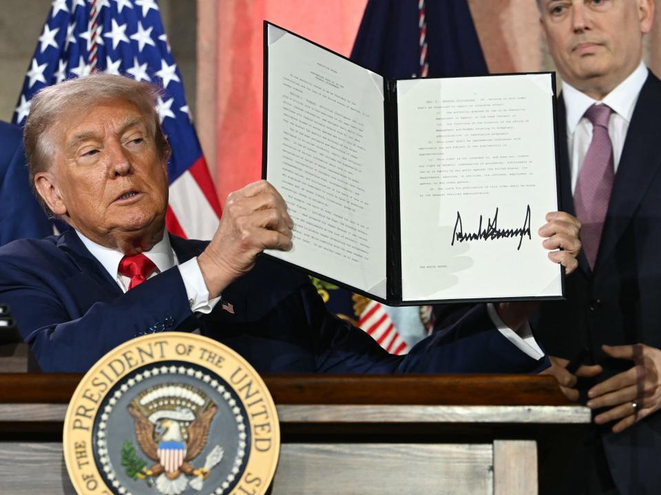 President Trump in Oval Office signing executive order on AI