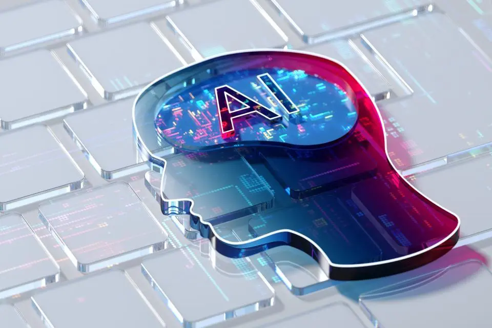 3D illustration of a human head silhouette with "AI" inside, placed on a computer keyboard, symbolizing artificial intelligence and technology integration.