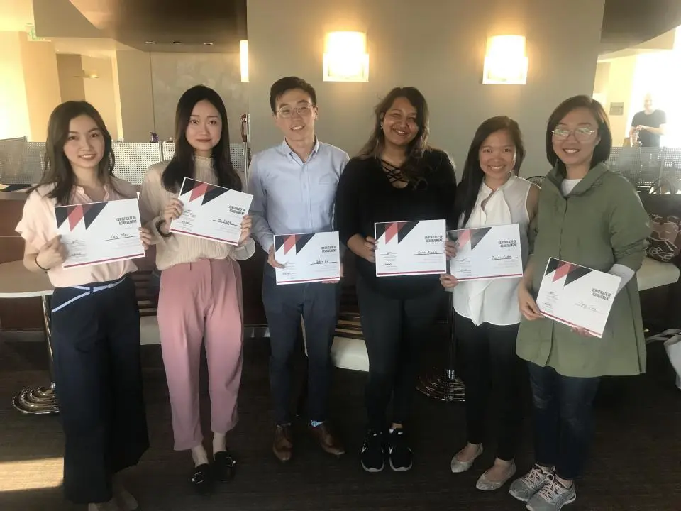 First place finishers from the Sunrun challenge, Lan Mei, Heidi Xiong, and Peter Li take a photo with the first place finishers in the Barco challenge, Cara Khan, Yuani Chen, and Jing Jing