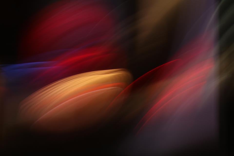 City lights as photographed through experimental techniques, transformed from the usual bright spots into stacks of graceful, shimmering discs.