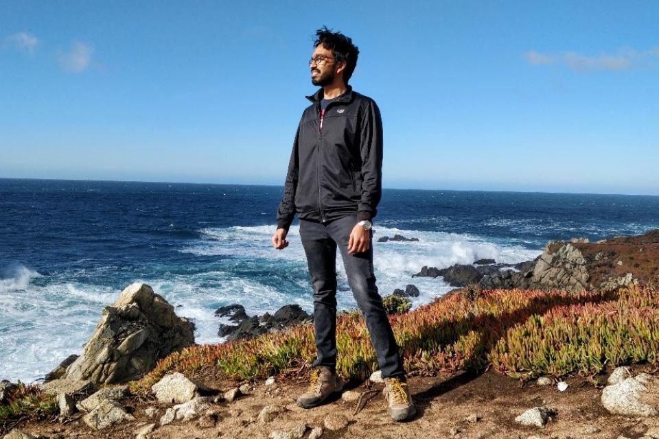 Tarun Chinniah MBA 21 stares out at the ocean