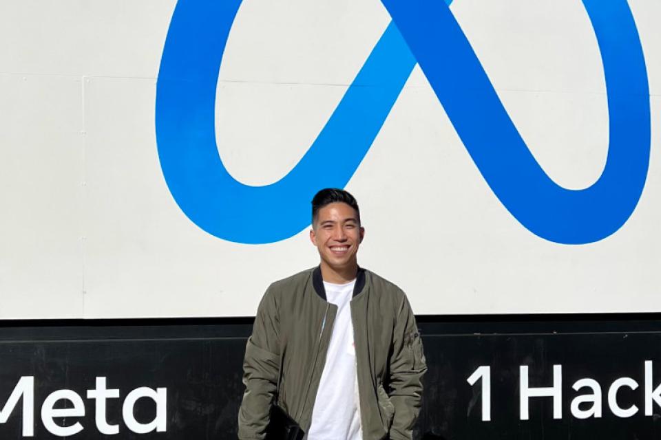 Part-time MBA student Kevin Leung MBA 23 stands outside his employer Meta.