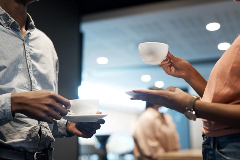 Coworkers getting coffee - iStock image