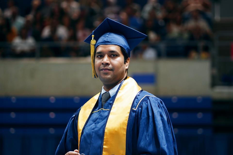 Abhinav Kishore in a cap and gown