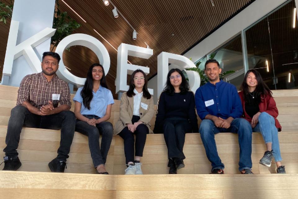 Six MSBA students sitting on the steps of the KQED offices