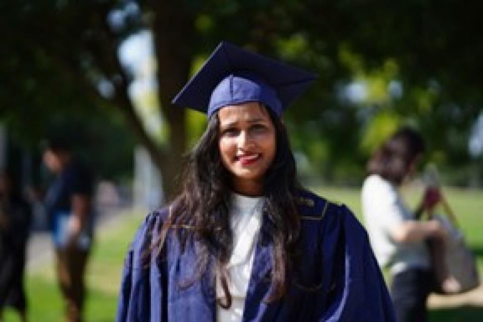 Arpita Mangal wearing a graduation cap and gown