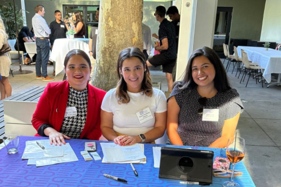 Marisol Ibarra sitting at an event table