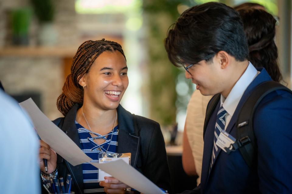 two MBA students dressed in business attire