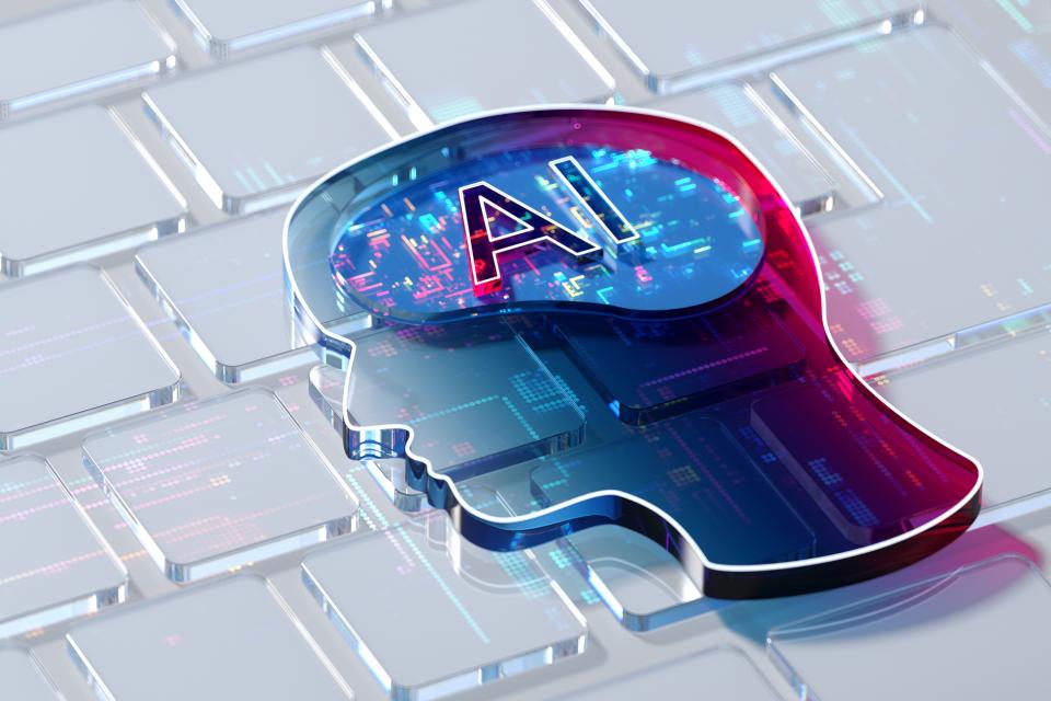 Image of AI emblazoned on brain overlaying keyboard