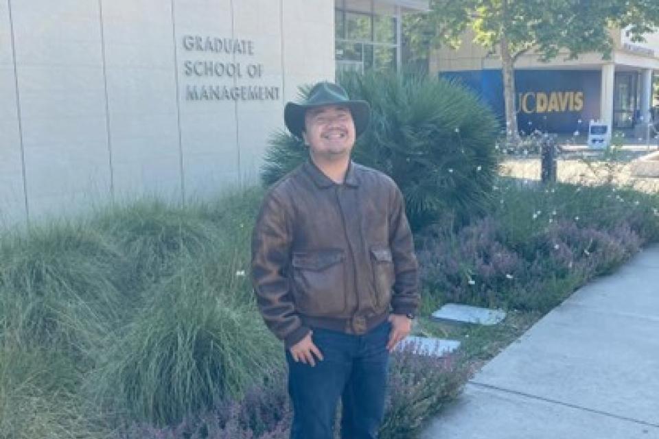 Michael Hui standing in front of Gallagher Hall